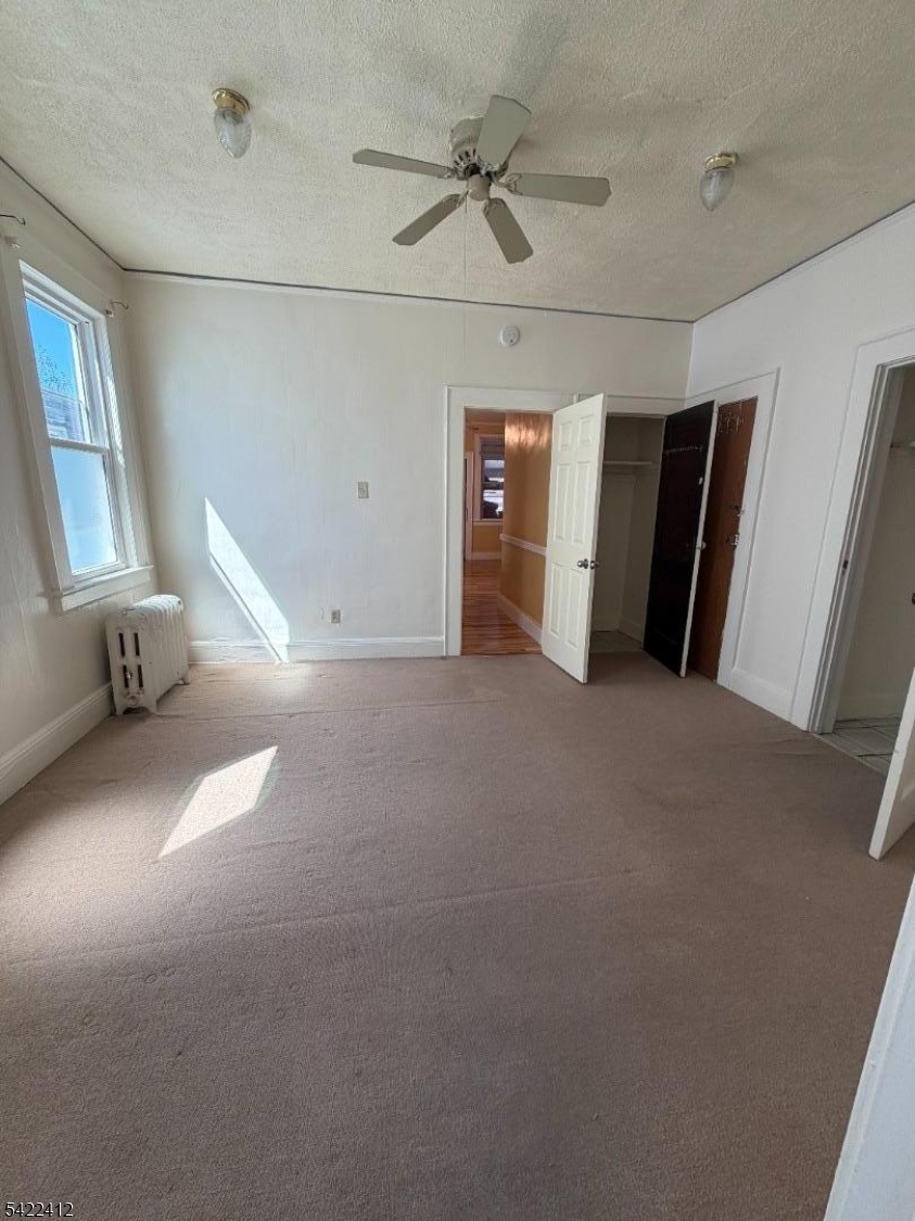 656 North 7th Street, Unit L2 Newark, NJ 07107 - Photo 6 of 12 a view of empty room with windows