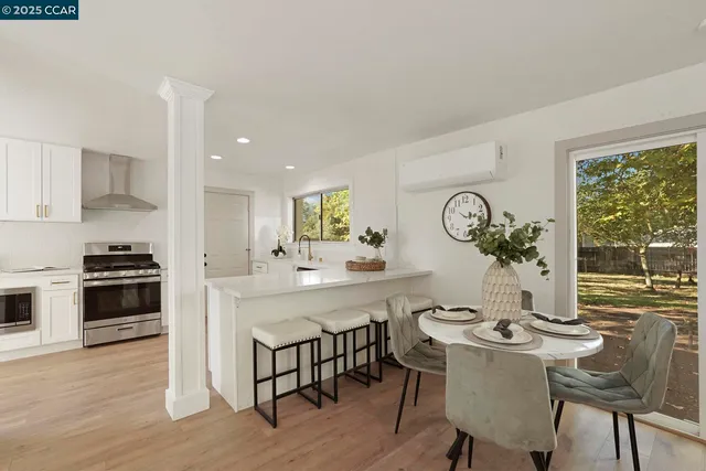 a kitchen with a table and chairs in it