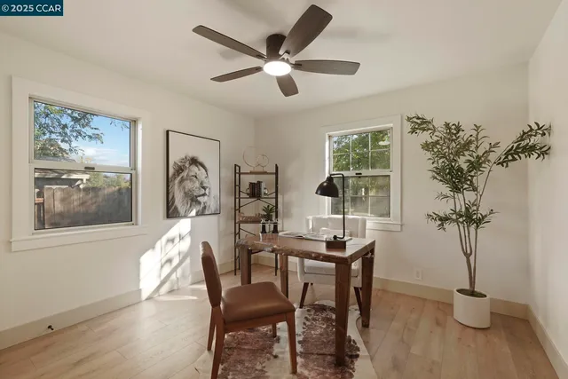 a view of a livingroom with furniture and a potted plant