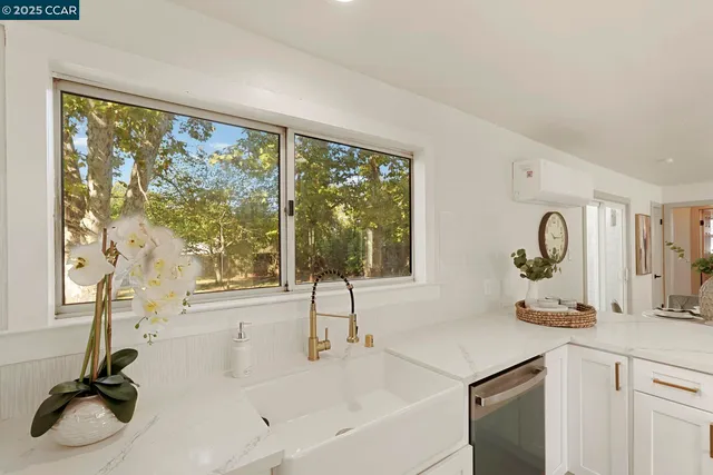 a bathroom with a double vanity sink and a large mirror