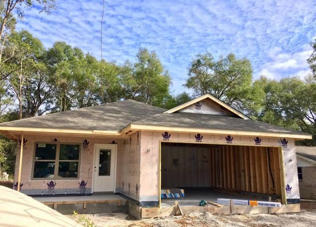 976 Valley Road Crestview, FL 32539 - Photo 2 of 26 a front view of a house with a yard