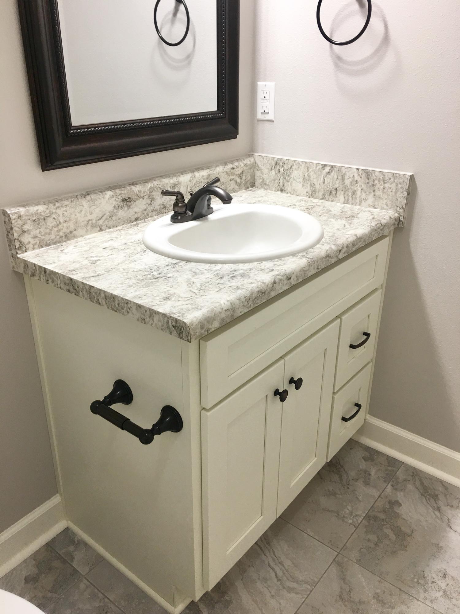 976 Valley Road Crestview, FL 32539 - Photo 13 of 26 a bathroom with a granite countertop sink and a mirror