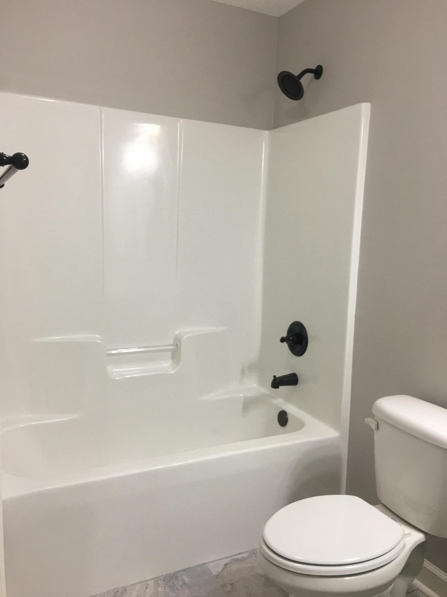 976 Valley Road Crestview, FL 32539 - Photo 14 of 26 a bathroom with a toilet and a bathtub