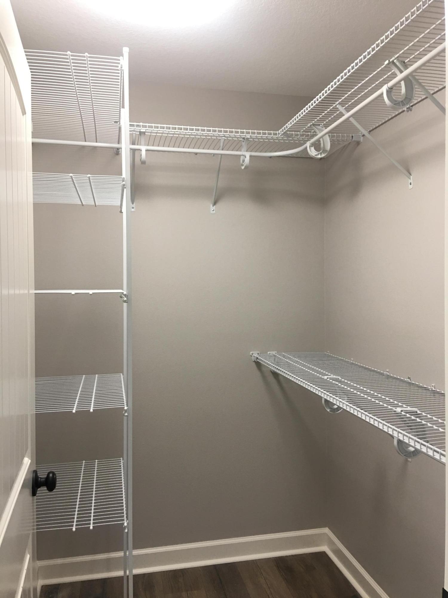 976 Valley Road Crestview, FL 32539 - Photo 16 of 26 a view of a room with racks on the wall