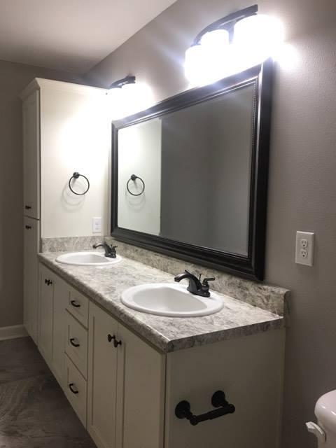 976 Valley Road Crestview, FL 32539 - Photo 24 of 26 a bathroom with a granite countertop sink and a mirror