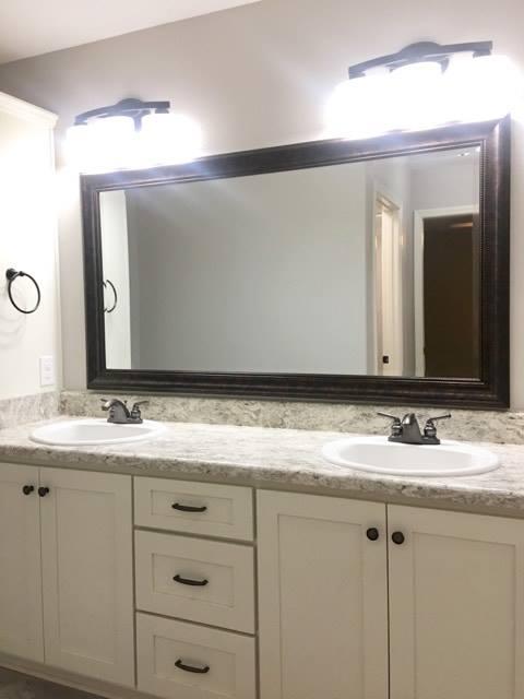 976 Valley Road Crestview, FL 32539 - Photo 26 of 26 a bathroom with a sink and a mirror