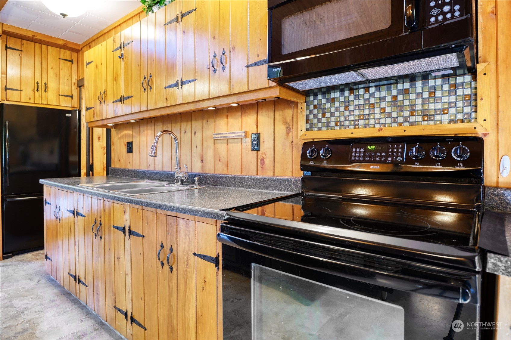 1986 Wellington Road Point Roberts, WA 98281 - Photo 7 of 26 a kitchen with stainless steel appliances granite countertop a stove and a sink