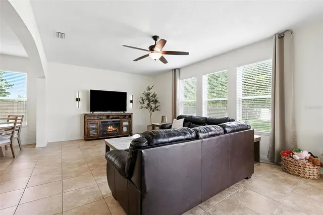 a view of a dining room with furniture and a chandelier