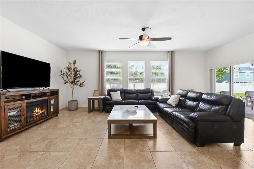 1653 Nature View Drive Lutz, FL 33558 - Photo 14 of 63 a living room with furniture and a flat screen tv