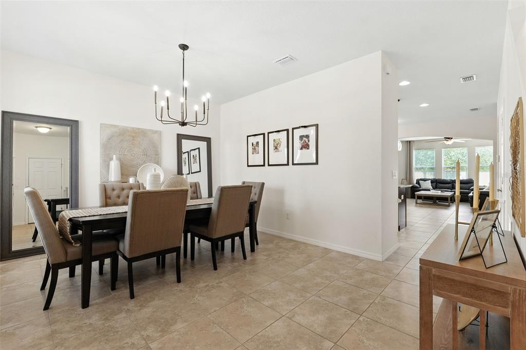 1653 Nature View Drive Lutz, FL 33558 - Photo 15 of 63 a view of a dining room with furniture and a chandelier