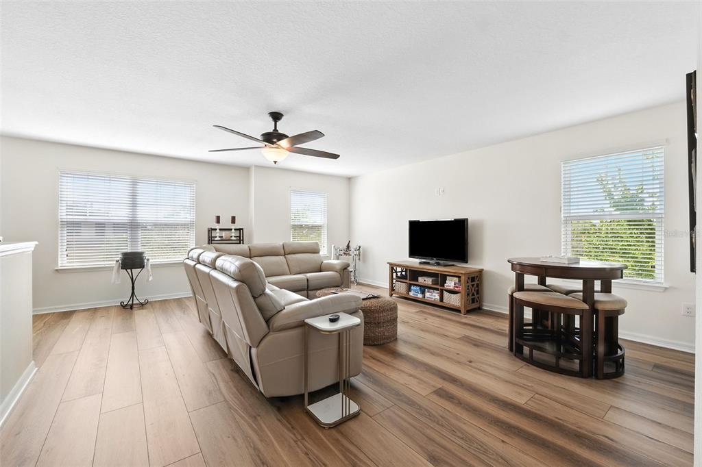 1653 Nature View Drive Lutz, FL 33558 - Photo 16 of 63 a living room with furniture and a flat screen tv