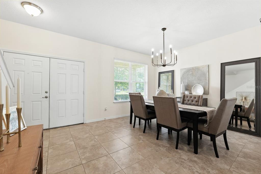 1653 Nature View Drive Lutz, FL 33558 - Photo 17 of 63 a view of a dining room with furniture window and wooden floor