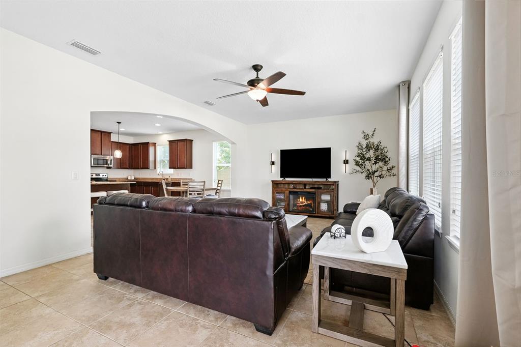 1653 Nature View Drive Lutz, FL 33558 - Photo 18 of 63 a living room with furniture and a flat screen tv