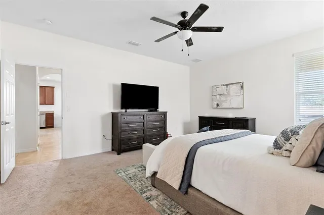 a spacious bathroom with a double vanity sink mirror and toilet