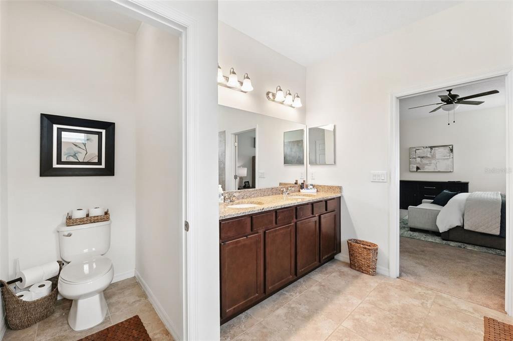 1653 Nature View Drive Lutz, FL 33558 - Photo 23 of 63 a spacious bathroom with a double vanity sink mirror and toilet