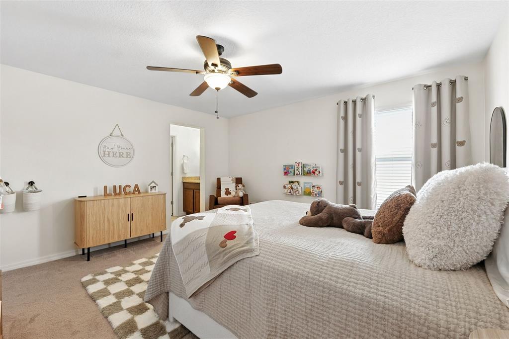 1653 Nature View Drive Lutz, FL 33558 - Photo 35 of 63 a bedroom with a bed and a window