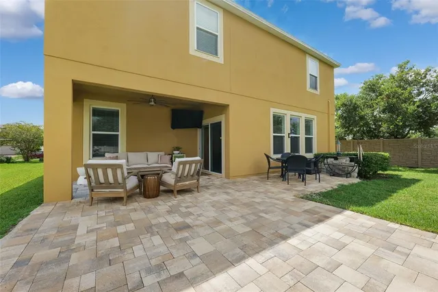 a view of house with backyard
