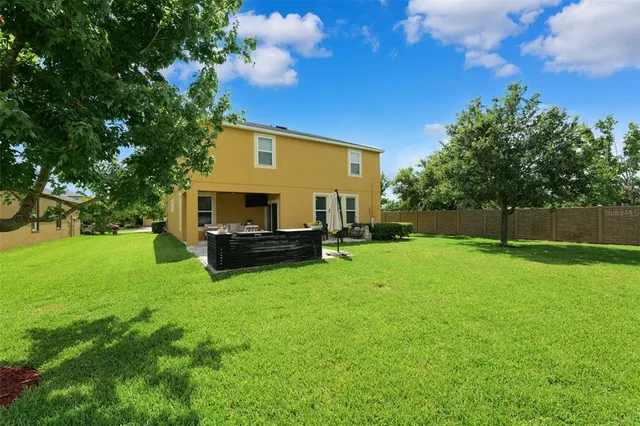 a view of backyard with green space