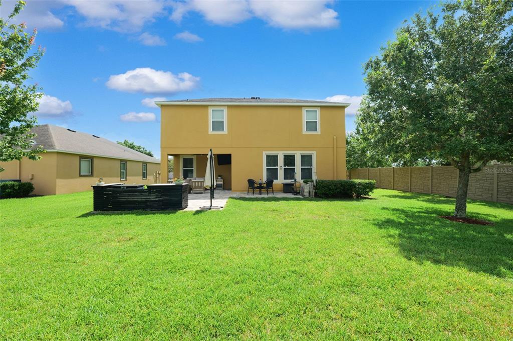 1653 Nature View Drive Lutz, FL 33558 - Photo 42 of 63 a view of house with backyard