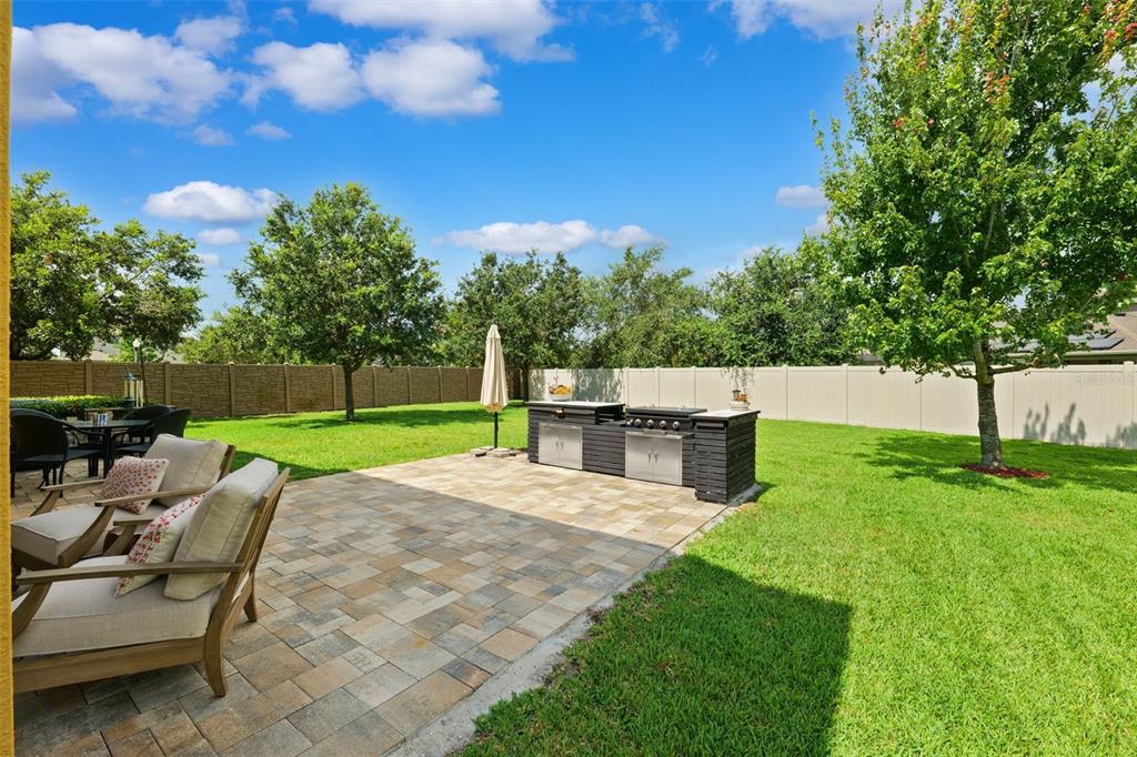 1653 Nature View Drive Lutz, FL 33558 - Photo 47 of 63 a view of backyard with seating area and trees
