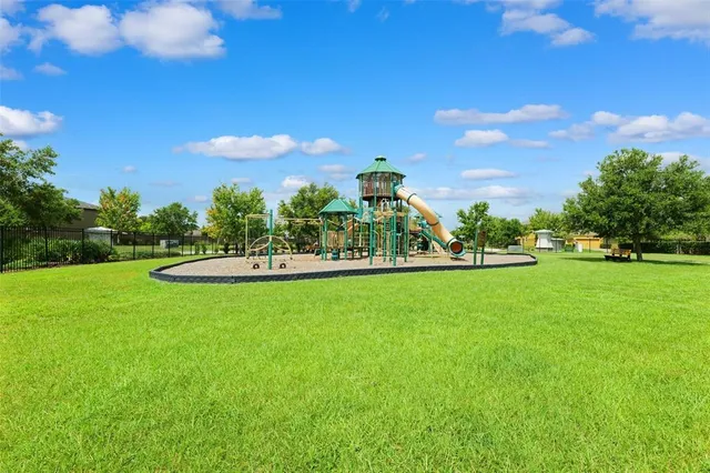 a view of a park with large trees