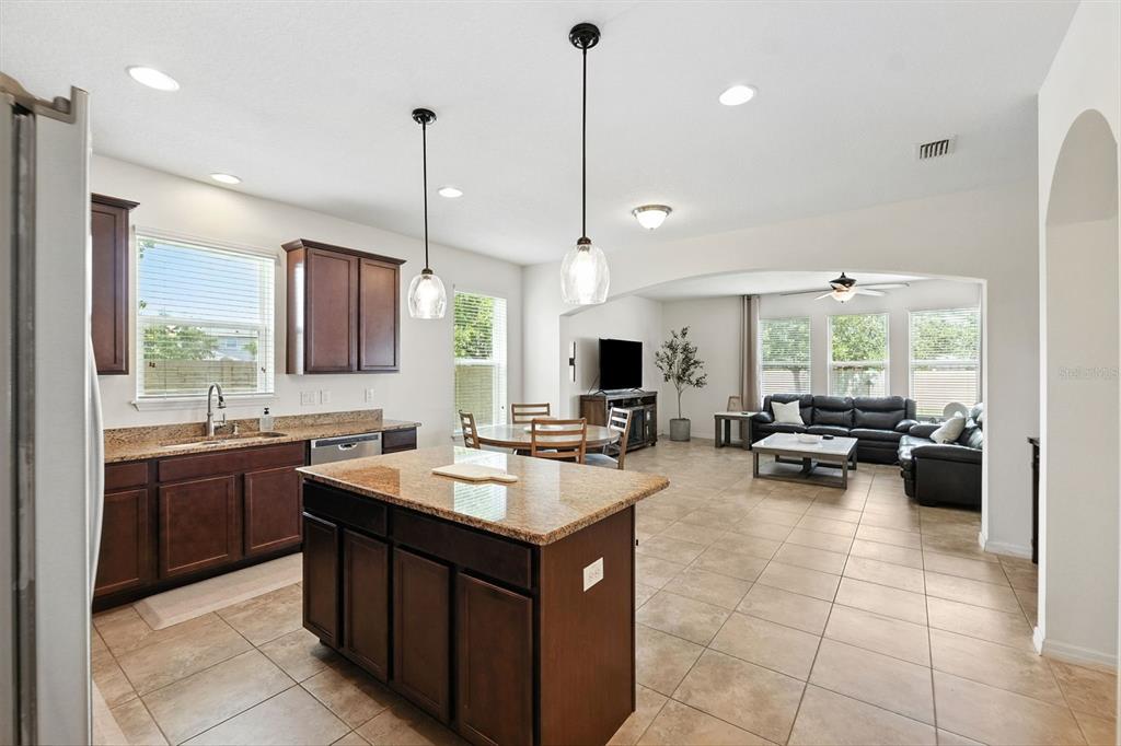 1653 Nature View Drive Lutz, FL 33558 - Photo 6 of 63 a kitchen with a sink a counter top space and living room view