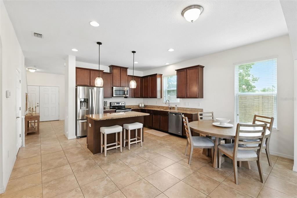 1653 Nature View Drive Lutz, FL 33558 - Photo 10 of 63 a kitchen with a table and chairs in it