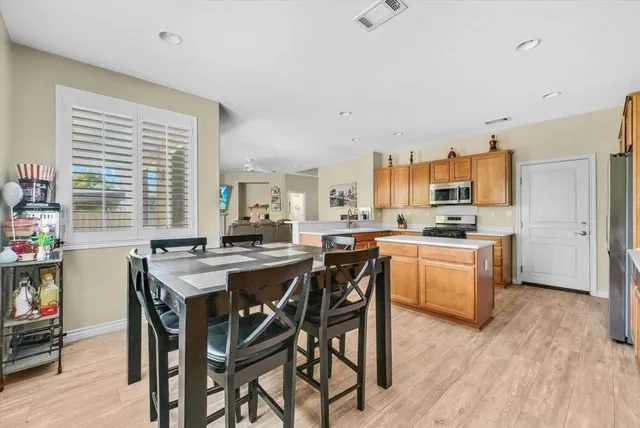 a kitchen with a table and chairs in it