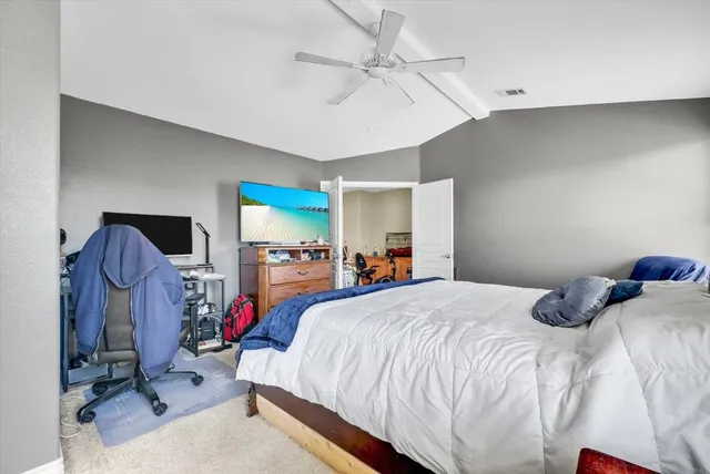 a spacious bathroom with a tub sink and mirror