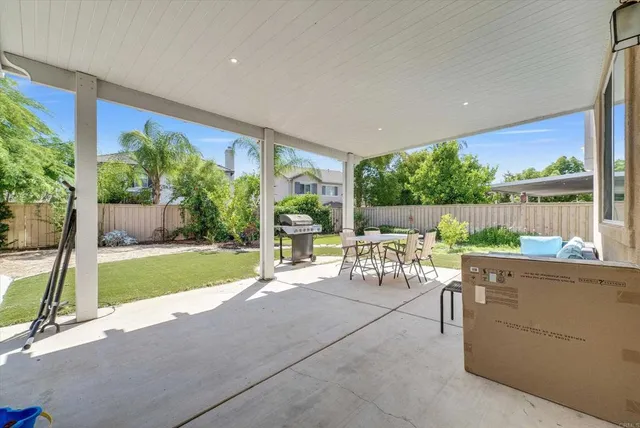 a view of an house with swimming pool and porch