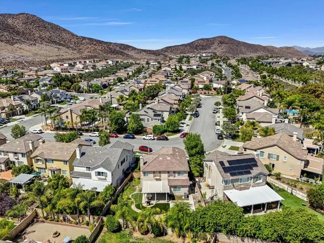 an aerial view of residential houses and street