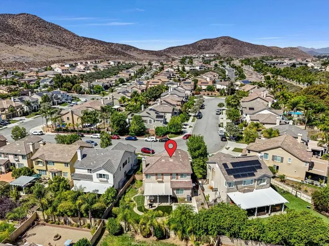 an aerial view of residential houses and outdoor space