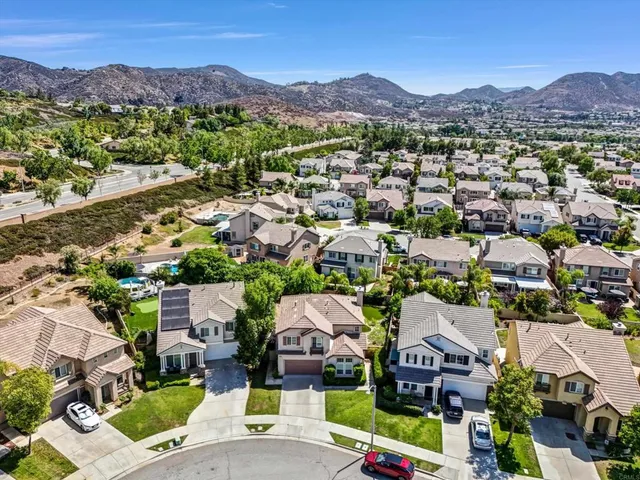 an aerial view of residential houses and outdoor space