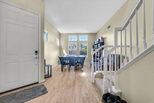a view of a livingroom with furniture and hardwood floor