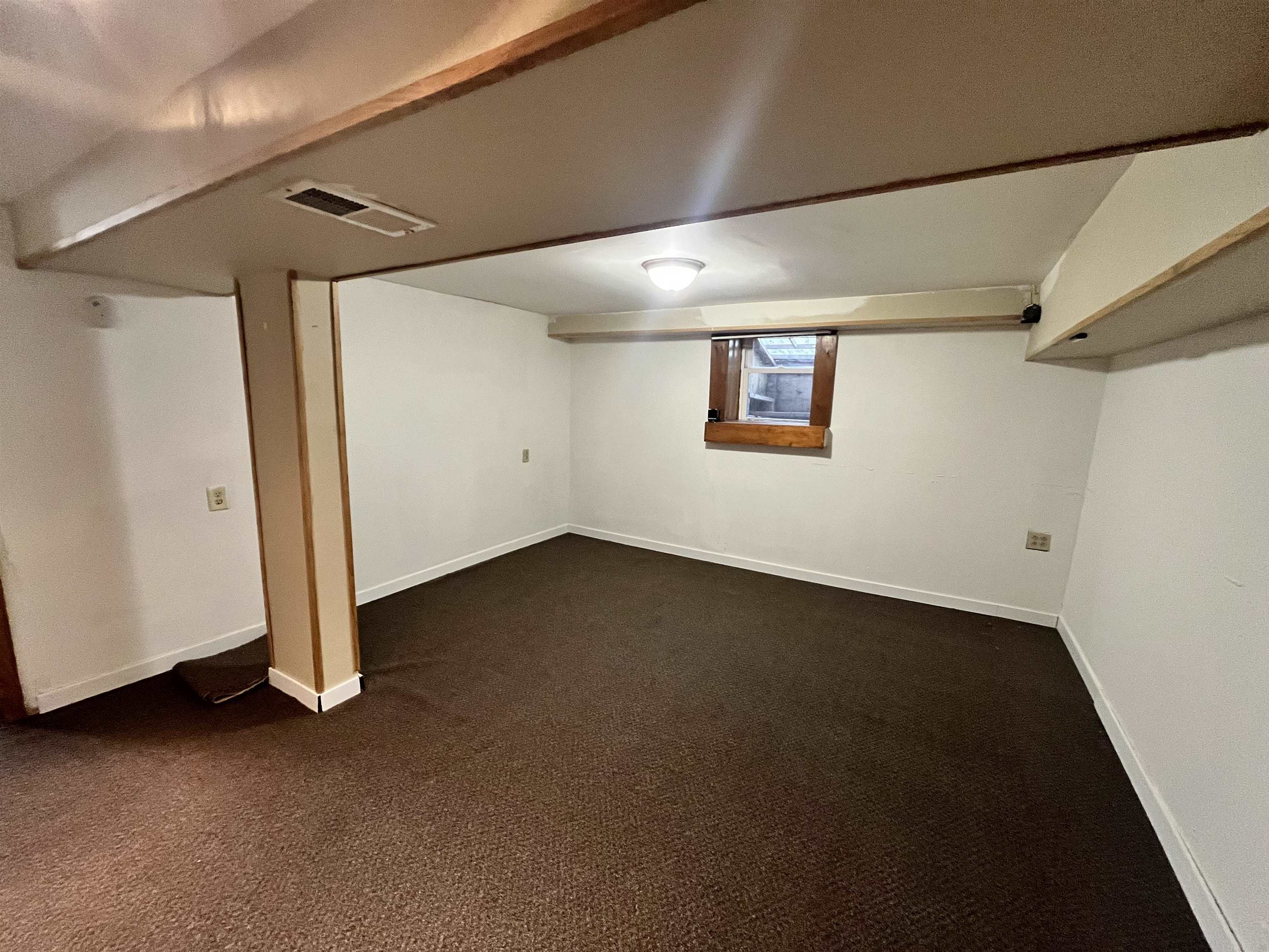 14 3rd Street Proctor, MN 55810 - Photo 16 of 19 Below grade area featuring dark colored carpet and baseboards