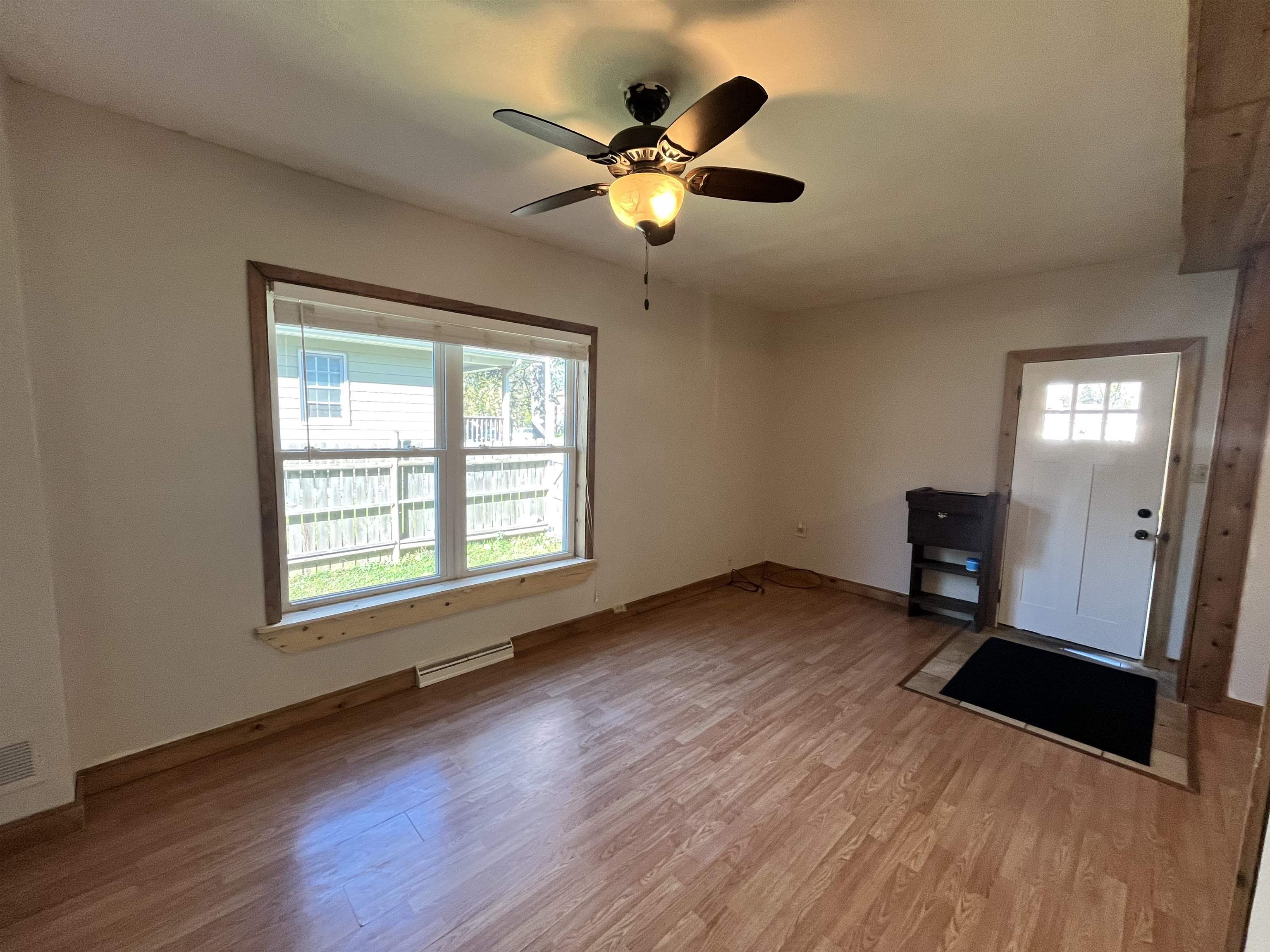 14 3rd Street Proctor, MN 55810 - Photo 3 of 19 Foyer entrance with wood finished floors and a ceiling fan