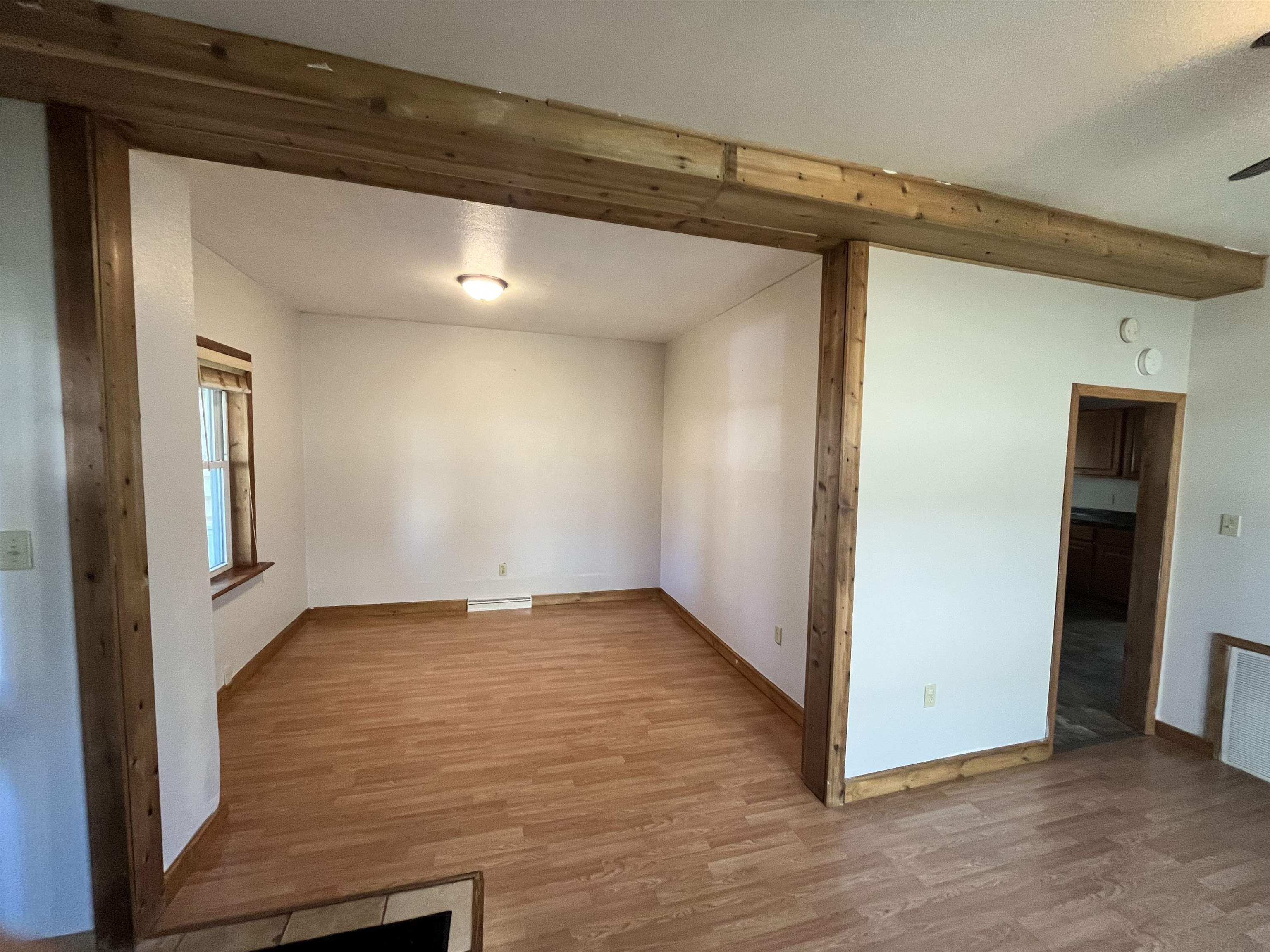 14 3rd Street Proctor, MN 55810 - Photo 4 of 19 Empty room featuring wood finished floors and baseboards