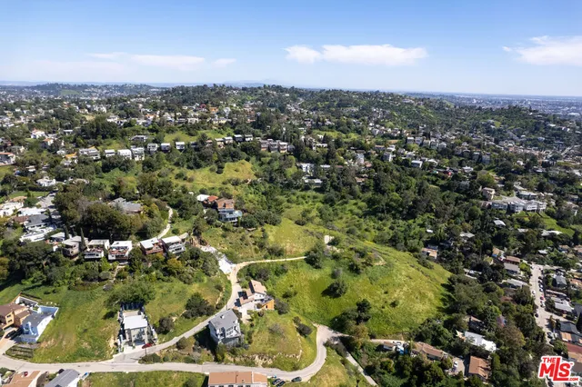 an aerial view of residential house and green space