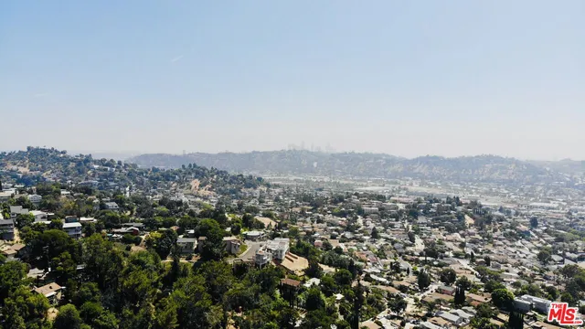 an aerial view of residential house and green space
