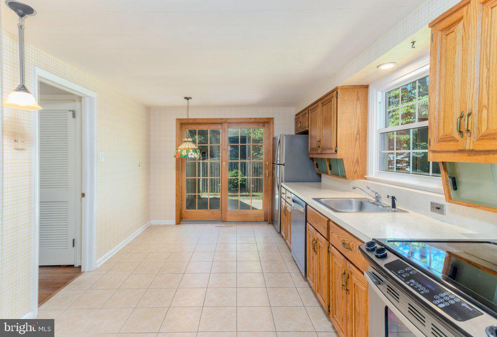 324 Wayland Road Cherry Hill, NJ 08034 - Photo 12 of 28 a view of a kitchen with stainless steel appliances granite countertop a sink and a large window