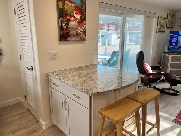 a view of a dining room with furniture and window