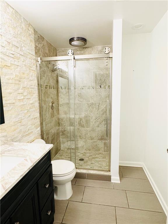 420 Old Holcomb Bridge Road Roswell, GA 30076 - Photo 14 of 30 a bathroom with a shower and a toilet