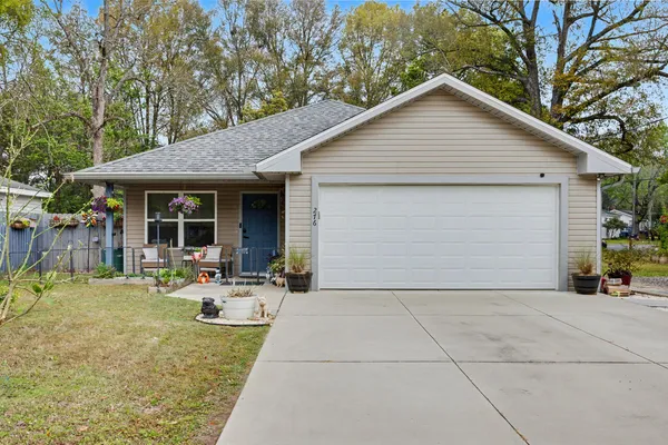 a front view of house with yard and seating area