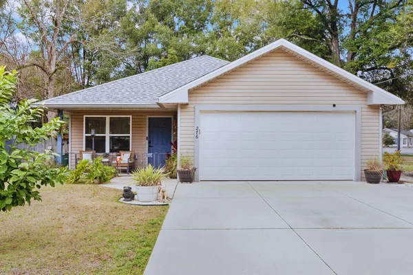 a kitchen with stainless steel appliances kitchen island granite countertop a refrigerator and microwave