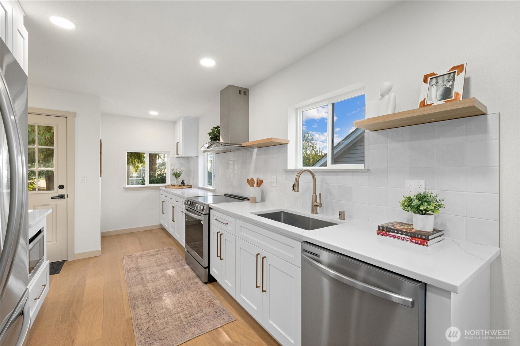 3711 Southwest Webster Street Seattle, WA 98126 - Photo 11 of 39 a kitchen with a sink stove and refrigerator