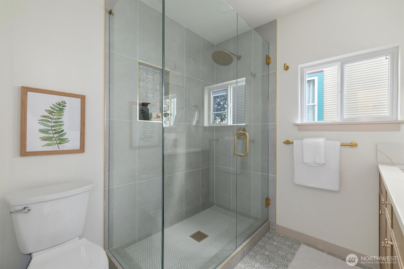 3711 Southwest Webster Street Seattle, WA 98126 - Photo 16 of 39 a bathroom with a shower a toilet and sink