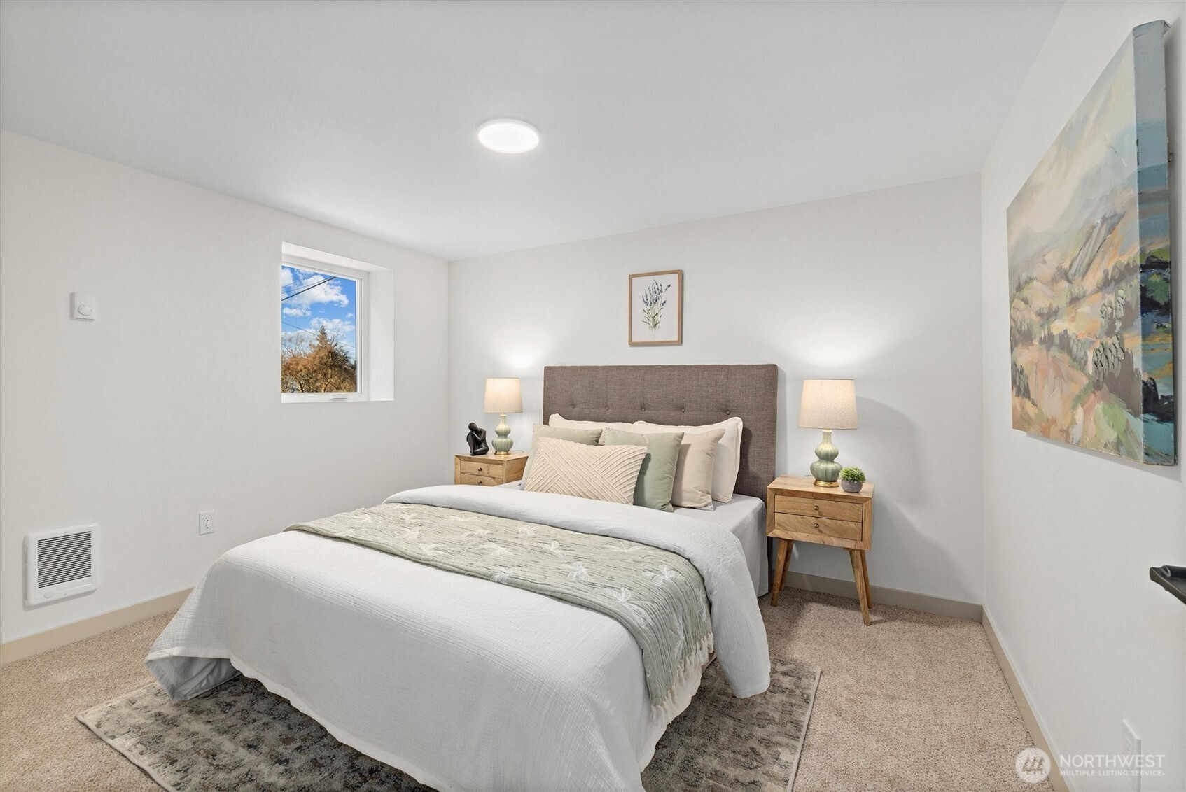 3711 Southwest Webster Street Seattle, WA 98126 - Photo 29 of 39 a bedroom with a bed and a painting on the wall