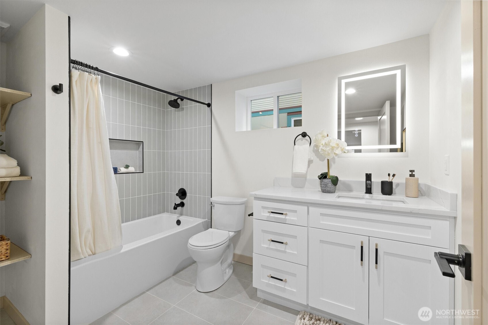 3711 Southwest Webster Street Seattle, WA 98126 - Photo 30 of 39 a bathroom with a bathtub shower sink and mirror