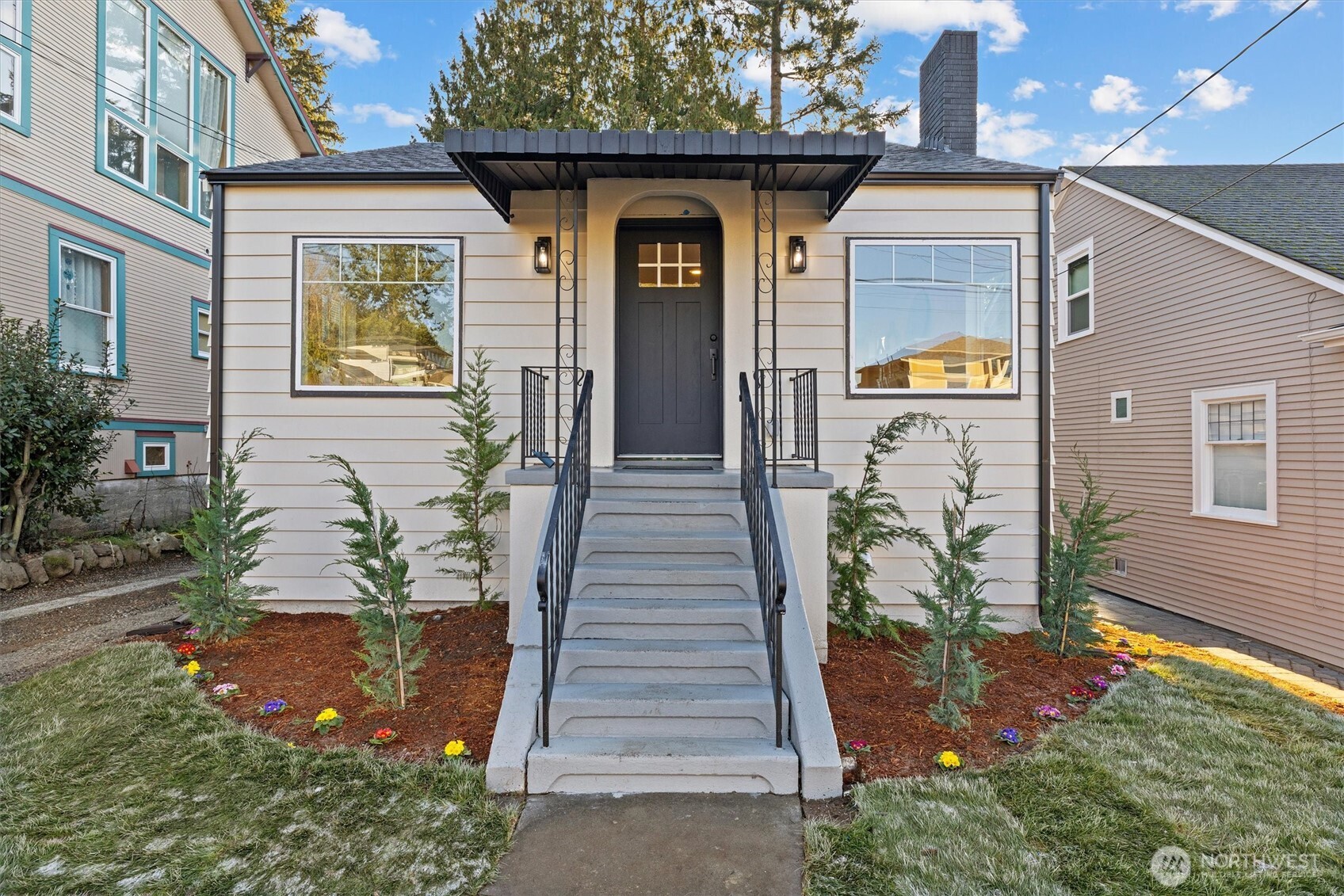 3711 Southwest Webster Street Seattle, WA 98126 - Photo 3 of 39 a front view of a house with a yard