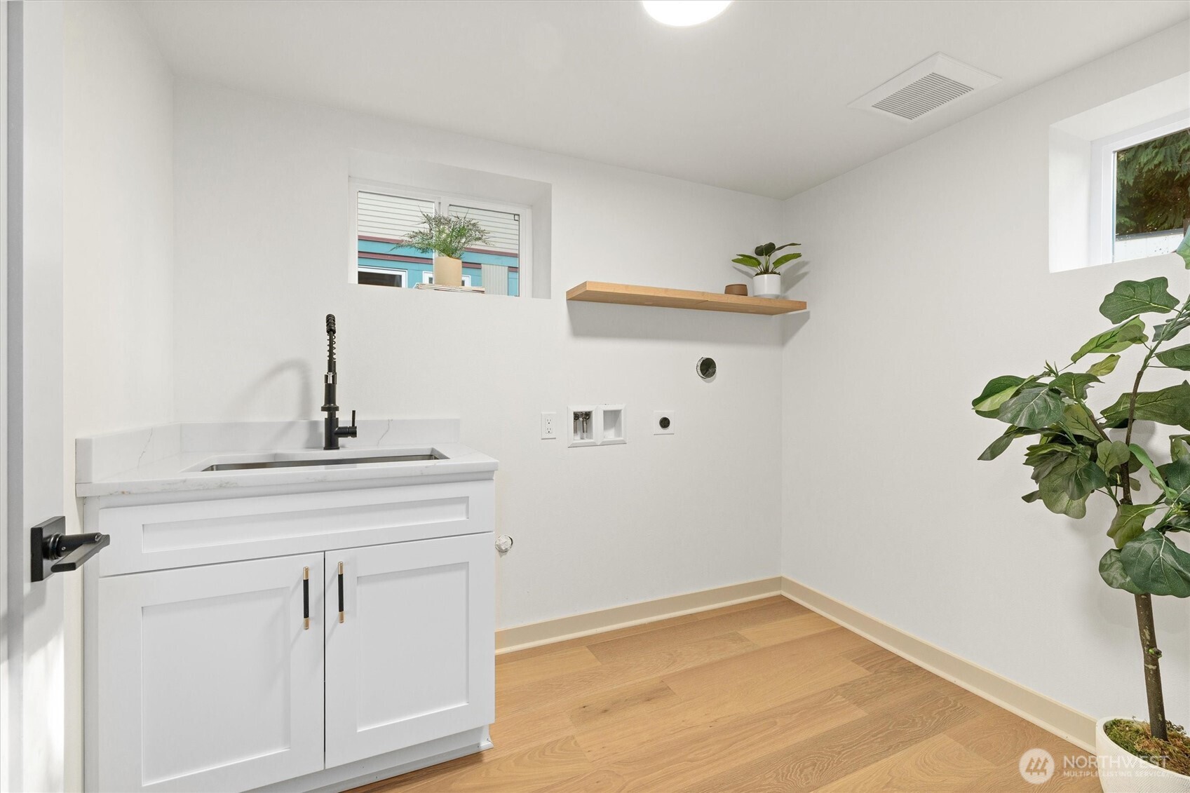 3711 Southwest Webster Street Seattle, WA 98126 - Photo 32 of 39 a bathroom with a sink and a mirror